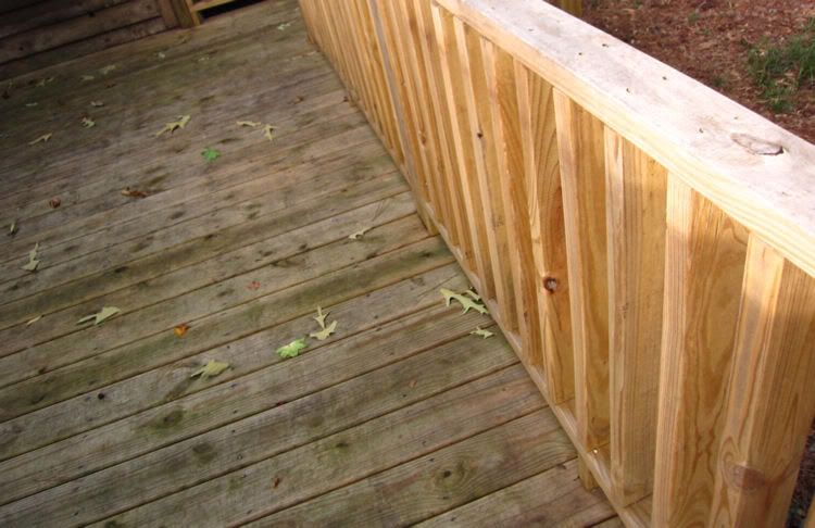 When is it safe to stain pressure-treated wood?